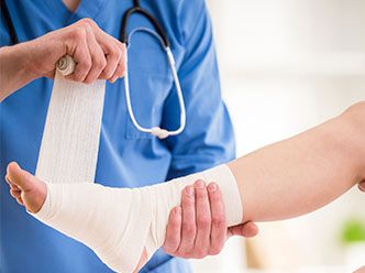 Doctor wrapping patient